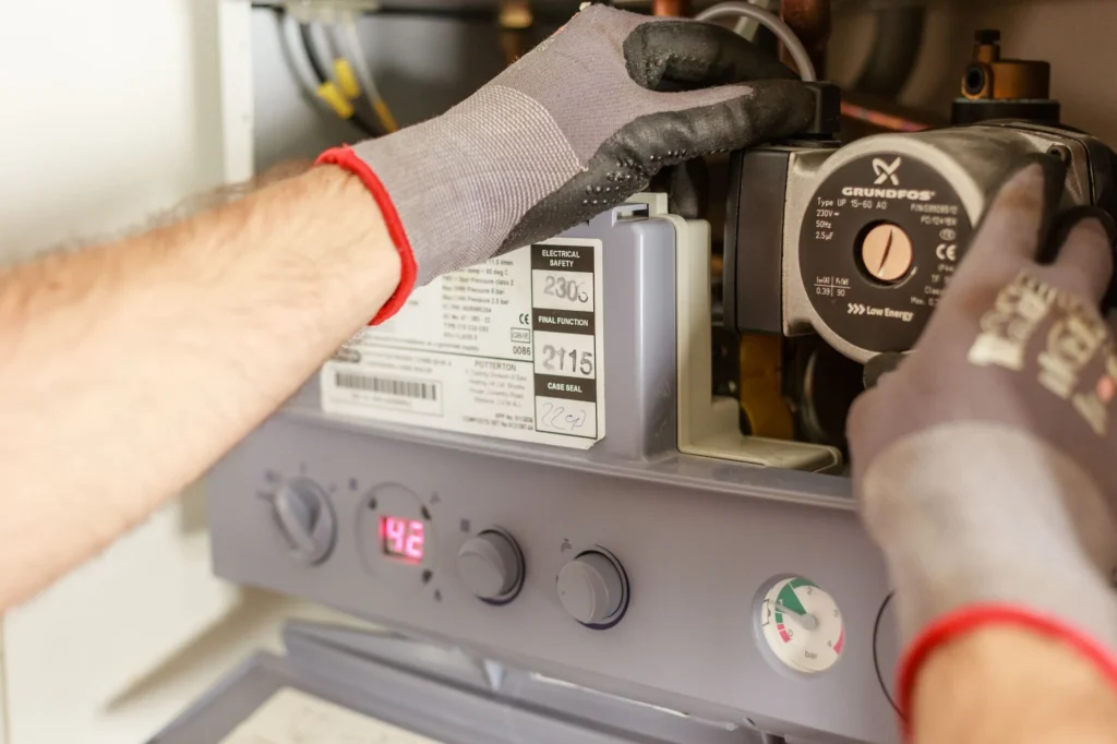 Engineer working on a boiler during a service